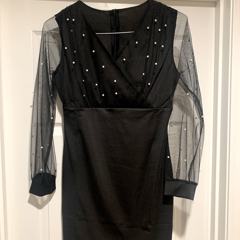Black dress. Sheer sleeves